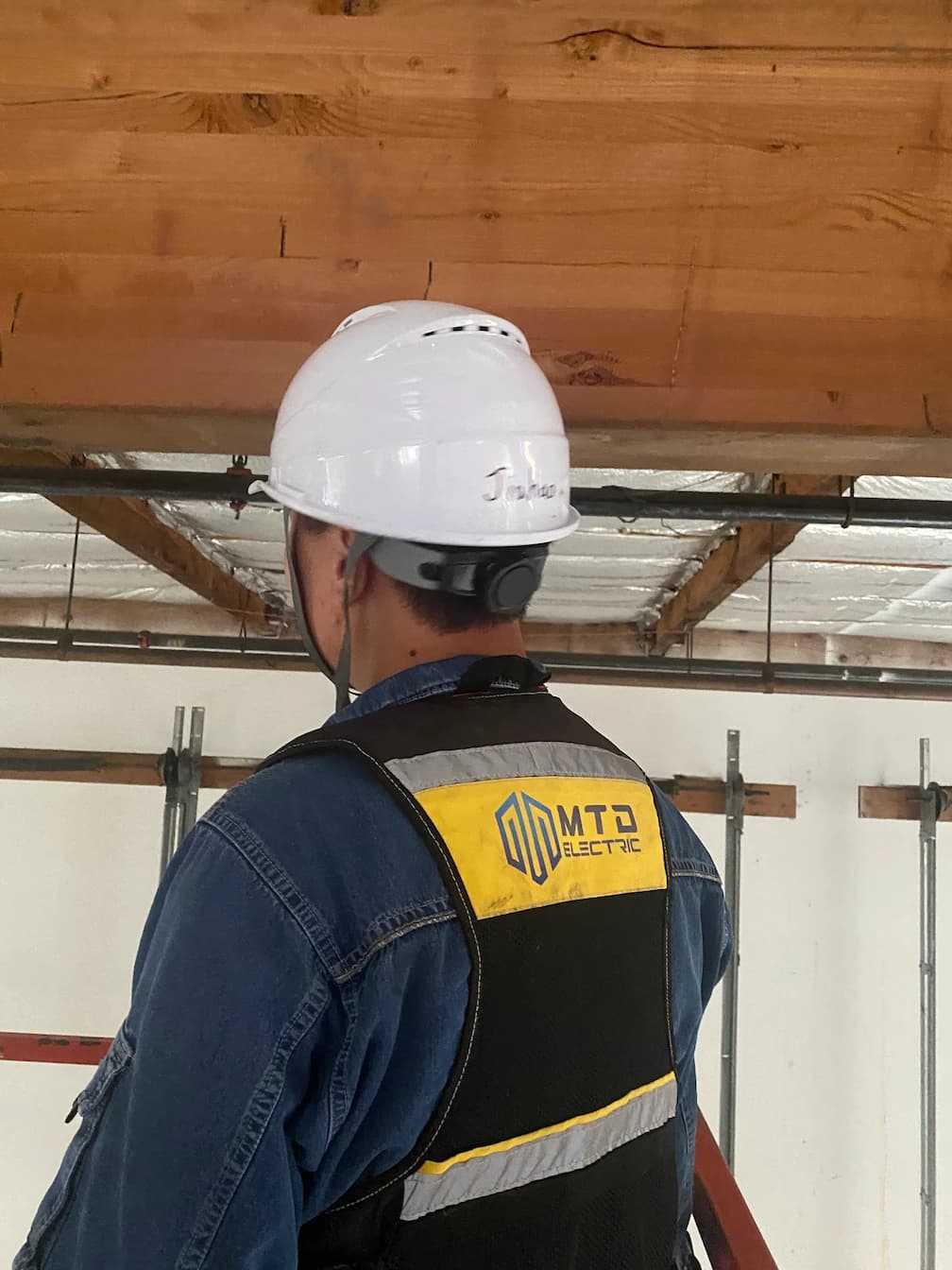 Professional electrical worker at site